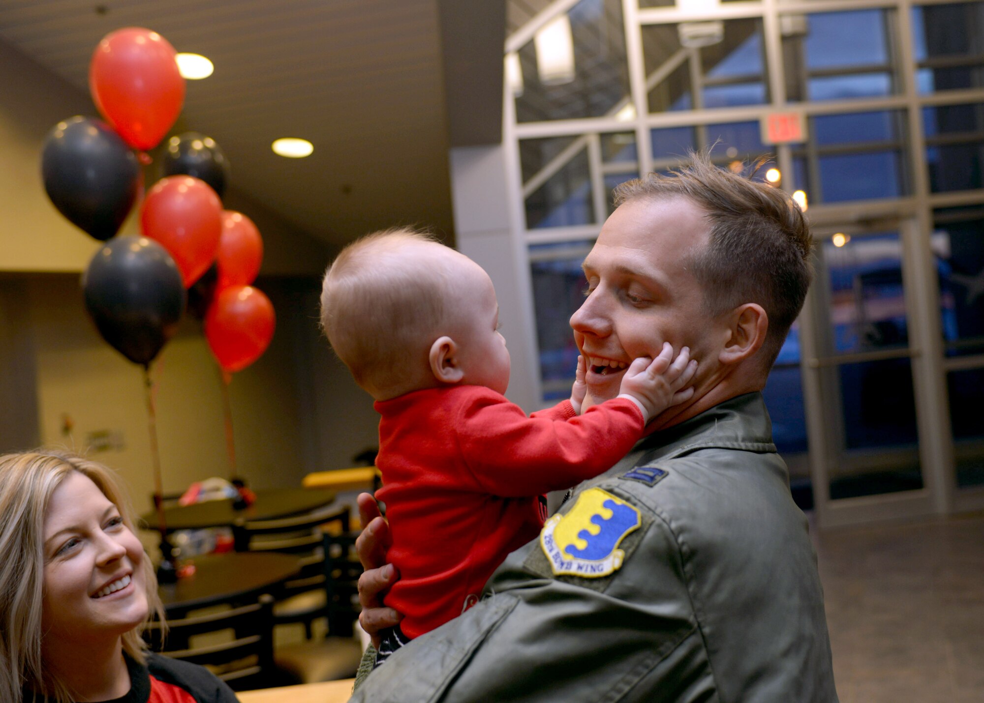 Capt. Chandler, a pilot assigned to the 34th Expeditionary Bomb Squadron, is welcomed home by his wife, Katelyn, and his son, John, at Ellsworth Air Force Base, S.D., Feb. 8, 2017. Approximately 300 Ellsworth Airmen deployed to Andersen Air Force Base, Guam, as part of the U.S. Pacific Command’s Continuous Bomber Presence mission.  This forward deployed presence demonstrated the United States continuing commitment to stability and security in the Indo-Asia-Pacific region. (U.S. Air Force photo by Airman 1st Class Donald C. Knechtel)