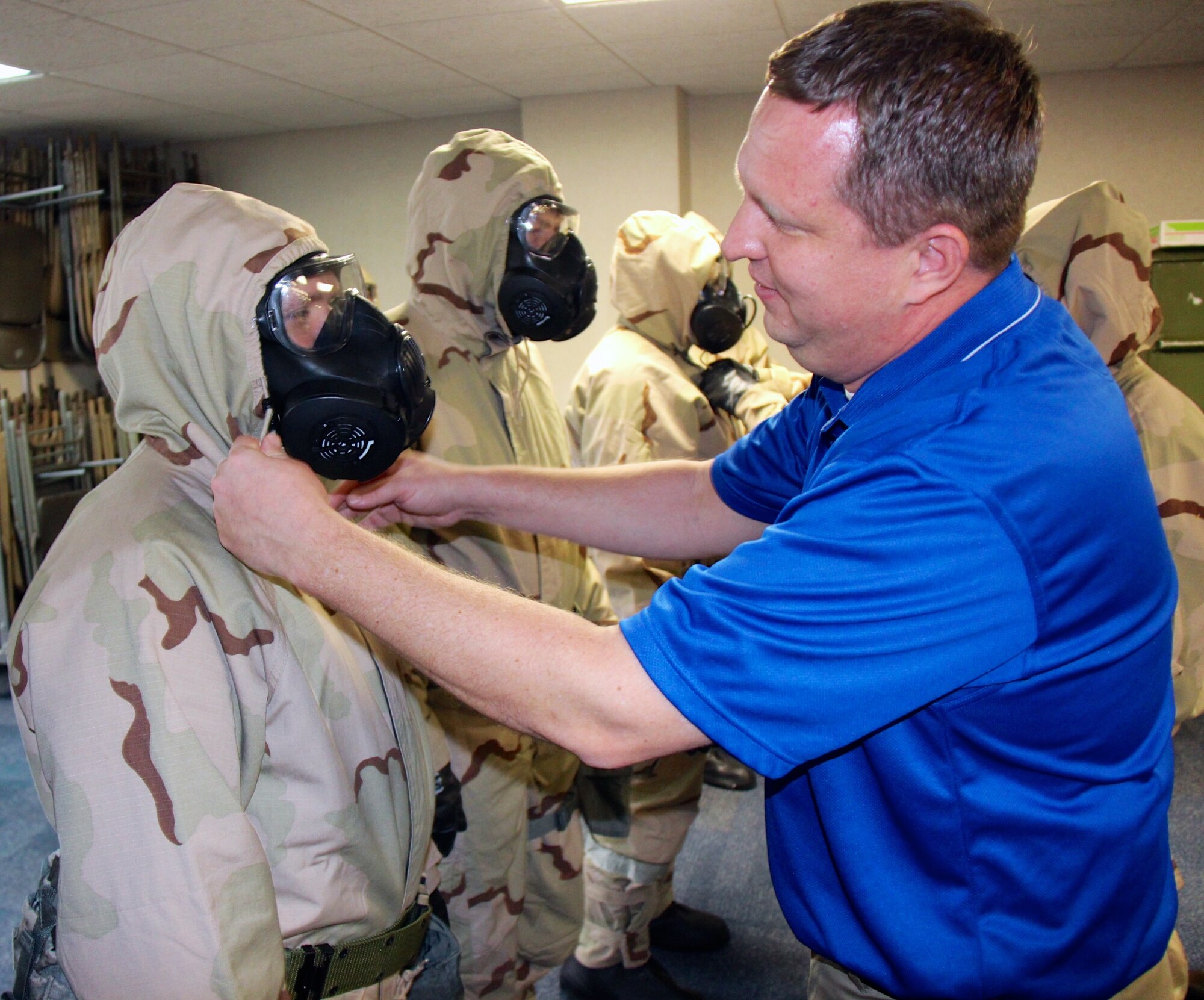 The wing had a chance to tell the readiness story to community leaders recently.  Various self aid, buddy care, and chemical protection classes were held February 6-7, 2017, at the 932nd Airlift Wing. The Air Force Reserve Command members in Illinois kept up to date on their current medical skills, preparing for any situation. A special guest visitor to the Illinois unit, and one of the wing's honorary commanders, was the Mayor of Troy, Mr. Allen Adomite (in blue shirt). He assisted and interacted with 932nd Airlift Wing Airmen like Maj. Christopher Kaighen, at left, in his gas mask, during the two day course held at Scott Air Force Base, Ill. (U.S. Air Force photo by Lt. Col. Stan Paregien)