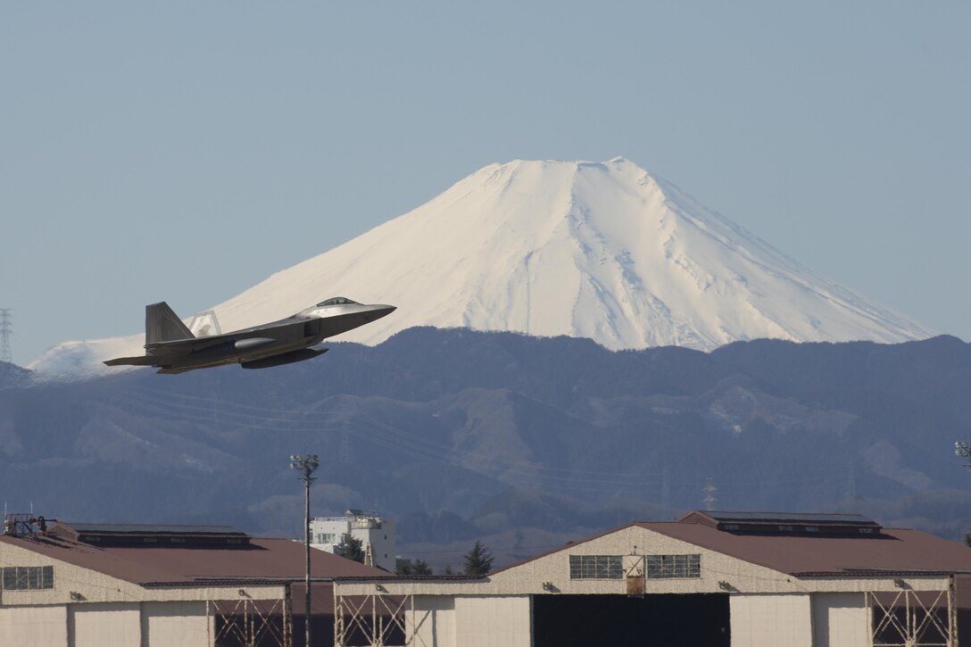 A U.S. Air Force F-22 Raptor from the 90th Fighter Squadron at Joint Base Elmendorf-Richardson, takes off at Yokota Air Base, Japan, Feb. 13, 2017. The F-22 Raptors stopped at Yokota AB before traveling on to Royal Australian Air Force Base, Tindal. As the Air Force’s Western Pacific airlift hub, Yokota supports transient aircraft as they conduct mission throughout the Indo-Asia Pacific Region. (U.S. Air Force photo by Yasuo Osakabe/Released)