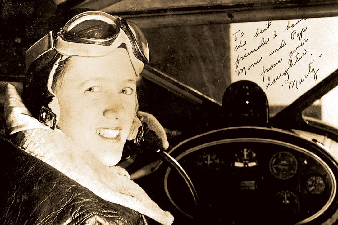 Marty Volkomener sits in the cockpit of her training aircraft