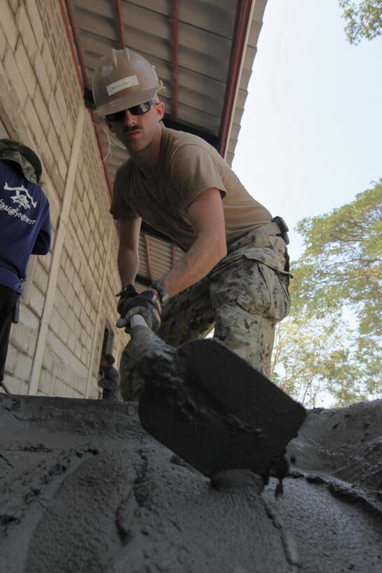 U.S. Navy Petty Officer 3rd Class Ryan McCullough, a builder with Naval Mobile Construction Battalion 5, mixes cement at Ban Kok Kee San Toor School, Khon Kaen Province, Thailand, during exercise Cobra Gold, Feb. 11, 2017. Cobra Gold, in its 36th iteration, focuses on humanitarian civic action (HCA), community engagement, and medical activities to support the needs and humanitarian interest of civilian populations around the region. (U.S. Marine Corps Combat Camera photo by Lance Cpl. Maximiliano Rosas)