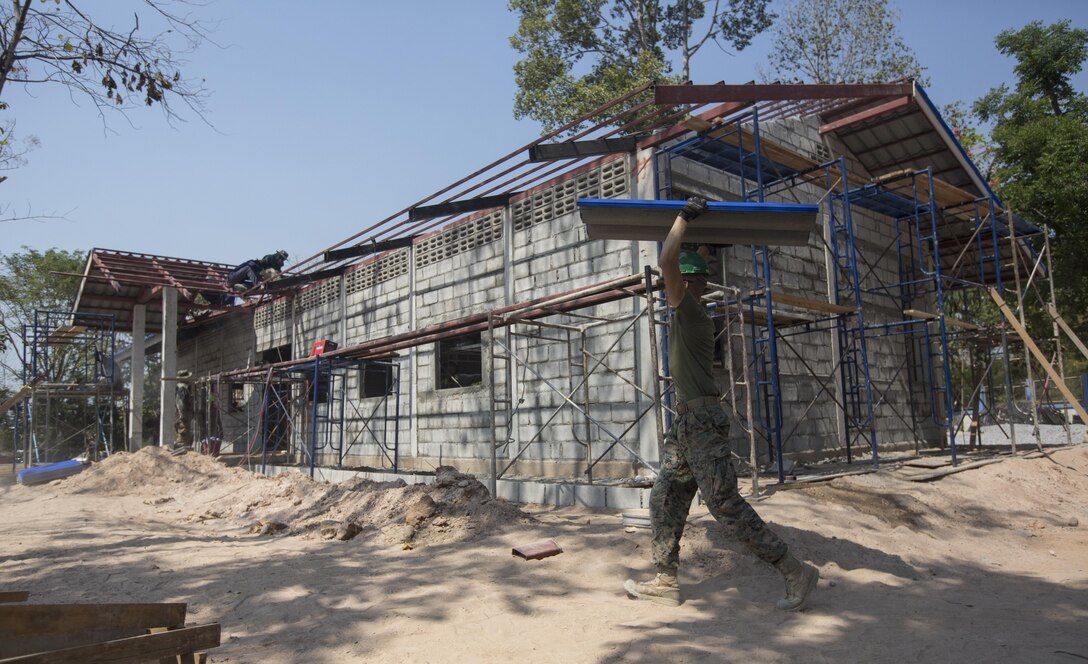 Service members from the United States, Thailand, and Malaysia, build a classroom at Ban Kok Kee San Toor, Khon Kaen Province, Thailand, during exercise Cobra Gold, Feb. 10, 2017. Cobra Gold, in its 36th iteration, focuses on humanitarian civic action, community engagement, and medical activities to support the needs and humanitarian interest of civilian populations around the region. (U.S. Marine Corps Combat Camera photo by Staff Sgt. Nathan O. Sotelo)