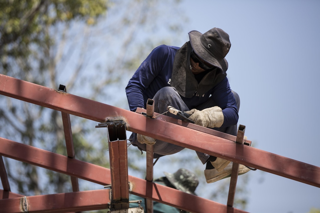 A Royal Thai Air Force airman welds at Ban Kok Kee San Toor, Khon Kaen Province, Thailand during the 36th iteration of exercise Cobra Gold, on Feb. 11, 2017.  Similar to last year, Cobra Gold 17 emphasizes coordination on civic action, such as humanitarian assistance and disaster relief, seeking to expand regional cooperation and collaboration in these vital areas.  (U.S. Marine Corps photo by Staff Sgt. Nathan O. Sotelo)