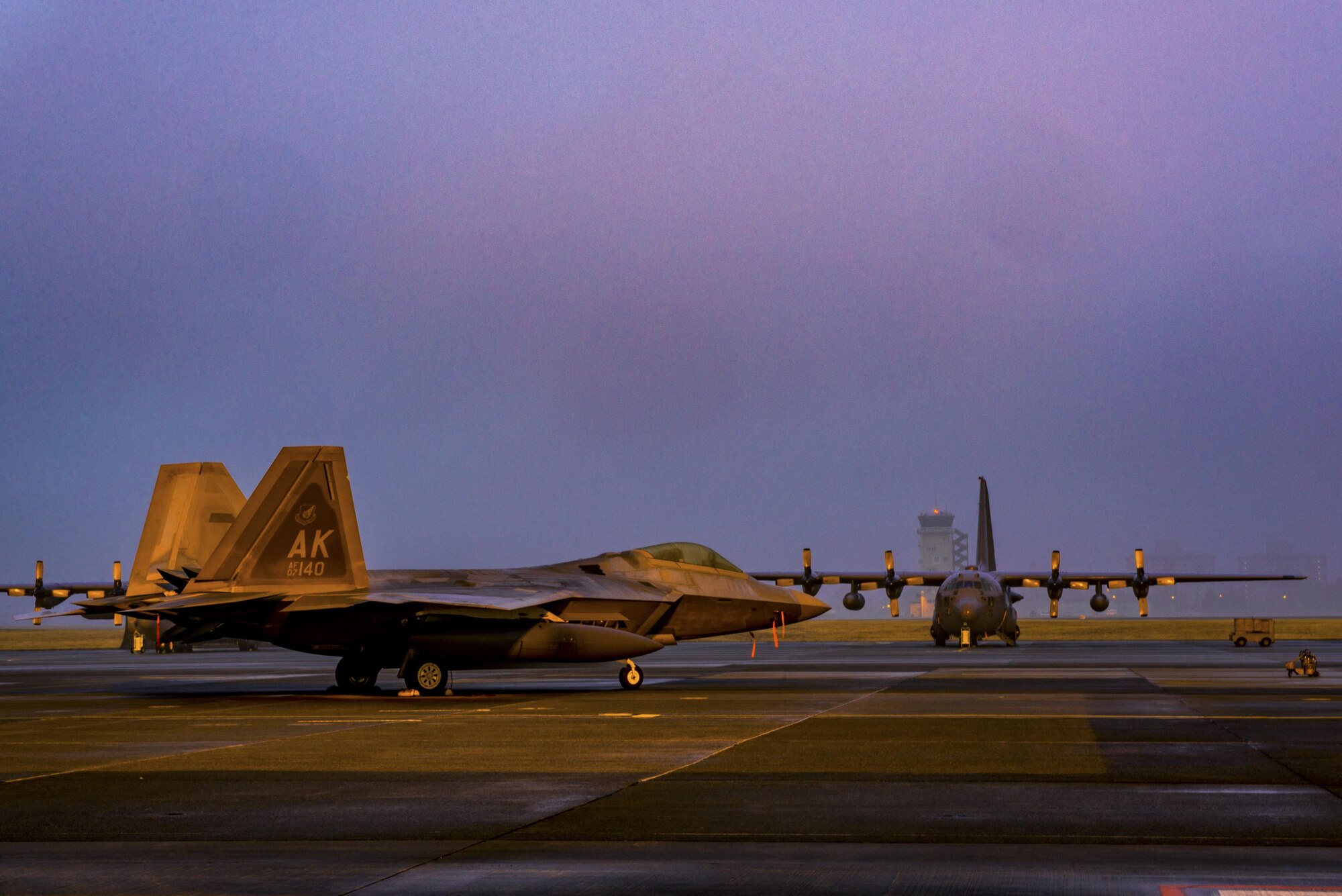 A U.S. Air Force F-22 Raptor from the 90th Fighter Squadron at Joint Base Elmendorf-Richardson, sits on the flight line at Yokota Air Base, Japan, Feb. 10, 2017. The F-22 Raptors stopped at Yokota AB before traveling on to Royal Australian Air Force Base, Tindal. As the Air Force’s Western Pacific airlift hub, Yokota supports transient aircraft as they conduct missions throughout the Indo-Asia Pacific Region. (U.S. Air Force photo by Airman 1st Class Donald Hudson)