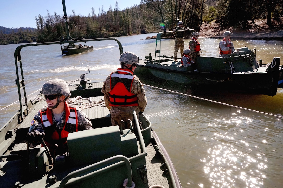 Army National Guard soldiers guide segments of an improved ribbon bridge during float-bridge training at Whiskeytown Lake, near Redding, Calif., Feb. 11, 2017. The soldiers are assigned to the California Army National Guard’s 132nd Multi-Role Bridge Company. The unit has been placed on alert after an unusually rainy winter. Army National Guard photo by Spc. Amy E. Carle
