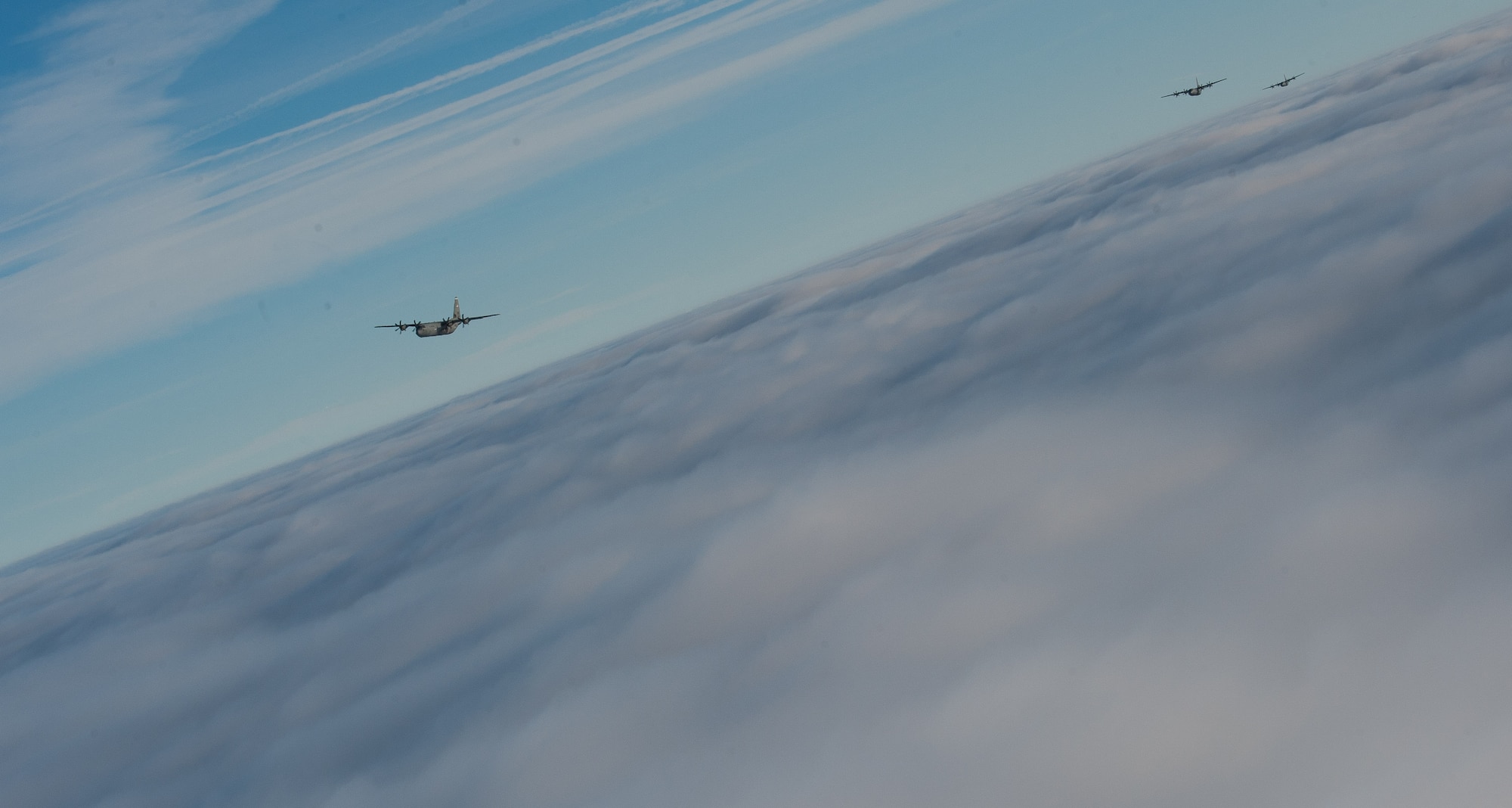 A formation of C-130J Super Hercules flies during the 37th Airlift Squadron’s 75th anniversary over Germany Feb. 10, 2017. Since its inception in 1942, the 37th AS has flown seven different aircraft. The C-130J Super Hercules was introduced to the unit in 2009 and remains its only active plane currently. (U.S. Air Force photo by Senior Airman Lane T. Plummer)