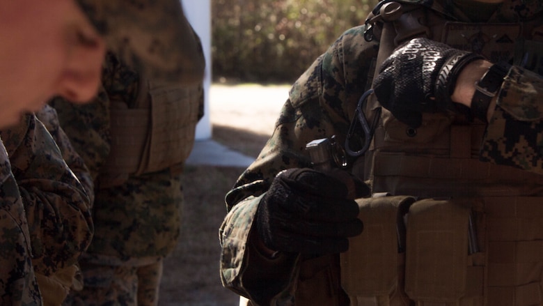 Marines with 2nd Law Enforcement Battalion prepare a M67 fragmentation hand grenade at Marine Corps Base Camp Lejeune, North Carolina, Feb. 9, 2017. The M67 fragmentation hand grenade has a lethal radius of 5 meters, and can produce causalities at of up to 15 meters, and dispersing fragments as far away as 230 meters. 