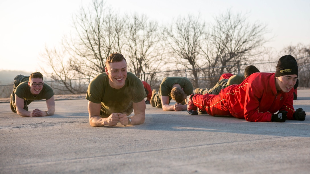 U.S. Marines with 9th Engineer Support Battalion, 3rd Marine Logistics Group, and Republic of Korea Marines with 1st Engineer Division, conduct physical training together during the exercise Korean Marine Exchange Program (KMEP) 17-8 on Sioux Range, Republic of Korea, January 28, 2017. KMEP is an annually scheduled training event designed to enhance to improve the tactical interoperability and camaraderie of the Republic of Korea and U.S. Marines by allowing them to work side-by-side as a cohesive unit. The alliance between America and the Republic of Korea has grown even stronger based upon the shared interests and values of both nations. 