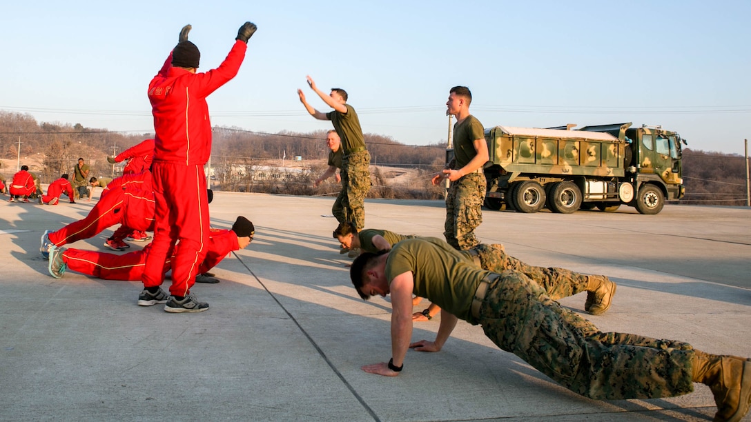 U.S. Marines with 9th Engineer Support Battalion, 3rd Marine Logistics Group, and Republic of Korea Marine, with 1st Engineer Division, conduct physical training together during the exercise Korean Marine Exchange Program (KMEP) 17-8 on Sioux Range, Republic of Korea, January 28, 2017. KMEP is an annually scheduled training event designed to enhance to improve the tactical interoperability and camaraderie of the Republic of Korea and U.S. Marines by allowing them to work side-by-side as a cohesive unit. The alliance between America and the Republic of Korea has grown even stronger based upon the shared interests and values of both nations. 