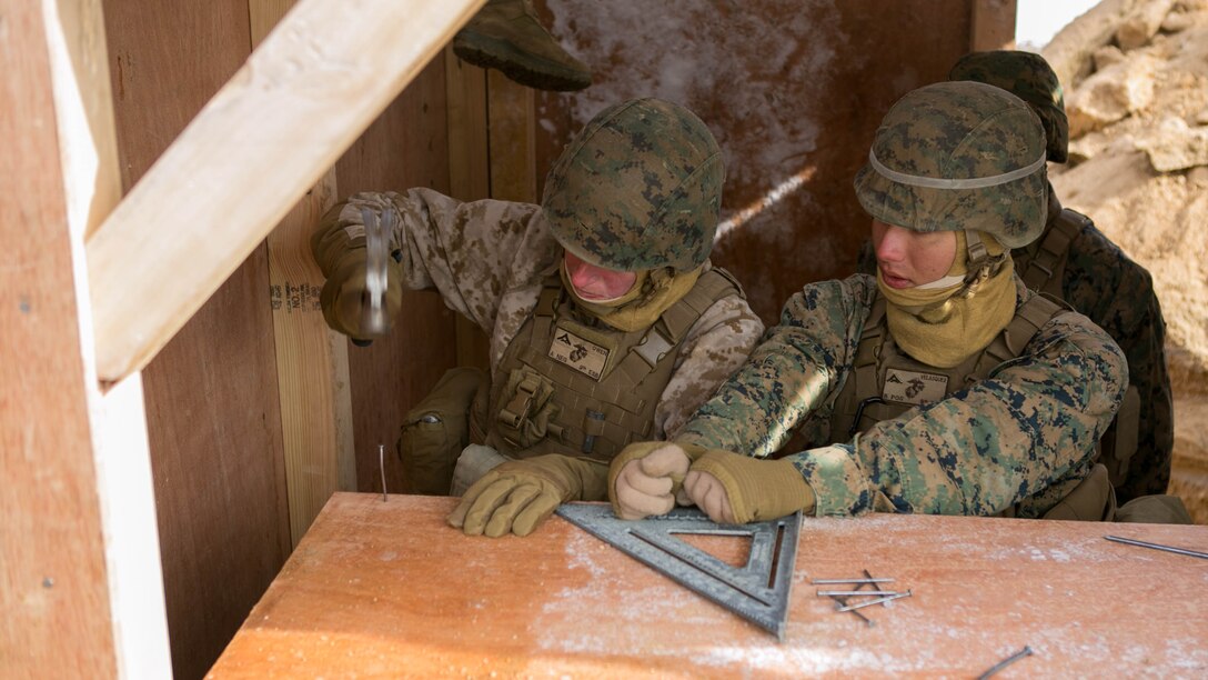 U.S. Marines with 9th Engineer Support Battalion, 3rd Marine Logistics Group, nail a shelf into the bunker during the exercise Korean Marine Exchange Program (KMEP) 17-8 on New Mexico Range, Republic of Korea, January 28, 2017. KMEP is an annually scheduled training event designed to enhance to improve the tactical interoperability and camaraderie of the ROK and U.S. Marines by allowing them to work side-by-side as a cohesive unit. The alliance between the U.S. and Republic of Korea has grown even stronger based upon the shared interests and values of both nations. 