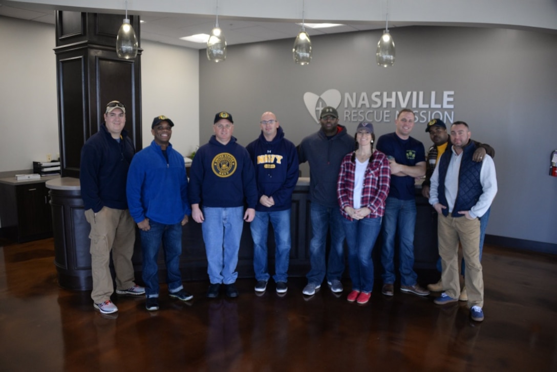 Sailors from Navy Recruiting District Nashville in Tennessee pose for a photo at the Nashville Rescue Mission where they performed volunteer work preparing and serving food for the homeless. Navy photo by Petty Officer 1st Class Timothy Walter