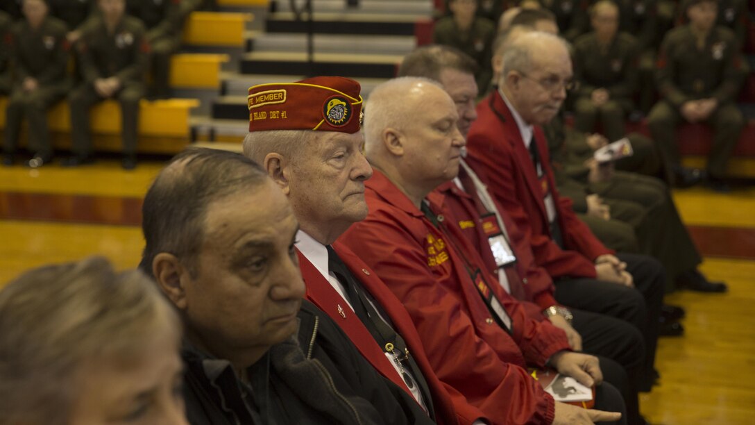 Marine veterans listen to Maj. Gen. John K. Love’s speech during a battle colors rededication ceremony for 2nd Marine Division at Camp Lejeune, N.C., Feb. 10, 2017. The veterans were the guests of honor and bestowed streamers upon the 2nd MarDiv’s colors. The event coincides with the 76th birthday of the division. 