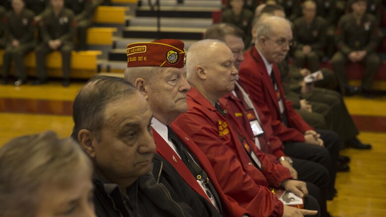 Marine veterans listen to Maj. Gen. John K. Love’s speech during a battle colors rededication ceremony for 2nd Marine Division at Camp Lejeune, N.C., Feb. 10, 2017. The veterans were the guests of honor and bestowed streamers upon the 2nd MarDiv’s colors. The event coincides with the 76th birthday of the division. 
