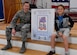 Lt. Col. Nathan Schwamburger, 628th Medical Group Dental Clinic chief of dental services, left, sits with Francisco Bartolome, Marrington Elementary School student body president, during a National Children’s Dental Health Month outreach event at Marrington Elementary School, Feb. 10, 2017. Establishing a good dental routine and going to the dentist regularly at an early age can help children develop life-long habits for healthy teeth and gums. The dental clinic will reach out to the Child Development Center, youth center and other schools throughout the month of February to educate children on dental health.