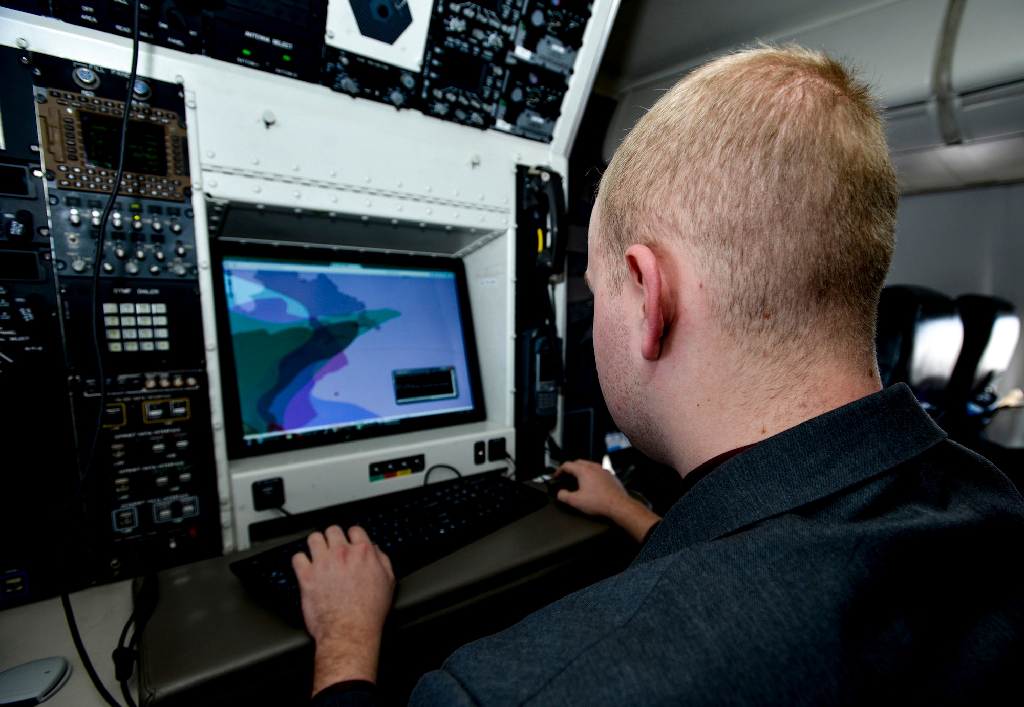 Airman 1st Class Matthew Hulse, 1st Airlift Squadron communication systems operator, monitors satellite signals and ranges as a C-40B aircraft departs the U.S. eastern seaboard enroute to Naval Air Station Rota, Spain, Feb. 4, 2017. Communications System Operators keep government leaders connected, extending the capabilities of their White House or Pentagon office to an airborne office anywhere on the globe. (U.S. Air Force photo by Senior Master Sgt. Kevin Wallace)