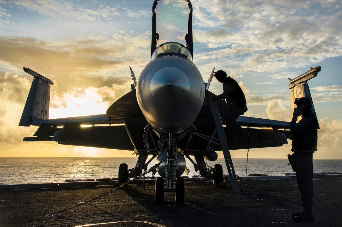 Sailors perform checks on an F/A-18E Super Hornet aircraft before flight operations on the aircraft carrier USS Carl Vinson in the Pacific Ocean, Feb. 7, 2017. The sailors are assigned to Strike Fighter Squadron 137. Navy photo by Petty Officer 2nd Class Sean M. Castellano