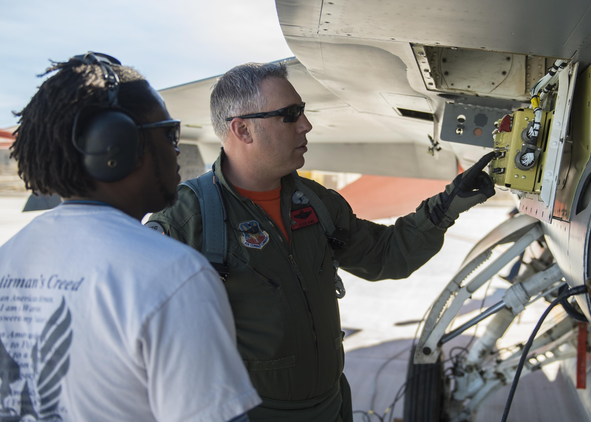Lt. Col. Ronald King (right), the 82nd Aerial Targets Squadron, Det. 1 commander, and John Anderson (left), the 82nd ATRS, Det. 1 maintenance lead, perform a pre-flight inspection on a QF-16 drone before flight on Feb. 10, 2017 at Holloman Air Force Base, N.M. King piloted the drone during the first flight since the 82nd ATRS, Det. 1 transitioned from QF-4 Phantoms to QF-16s. The QF-16 serves as a full-scale aerial target to test next-generation weapons systems. (U.S. Air Force photo by Senior Airman Emily Kenney)