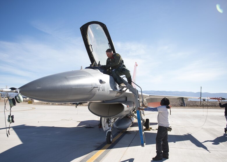 Lt. Col. Ronald King (left), the 82nd Aerial Targets Squadron, Det. 1 commander, and John Anderson (right), the 82nd ATRS, Det. 1 maintenance lead, perform a pre-flight inspection on a QF-16 drone before flight on Feb. 10, 2017 at Holloman Air Force Base, N.M. King piloted the drone during the first flight since the 82nd ATRS, Det. 1 transitioned from QF-4 Phantoms to QF-16s. The QF-16 serves as a full-scale aerial target to test next-generation weapons systems. (U.S. Air Force photo by Senior Airman Emily Kenney)