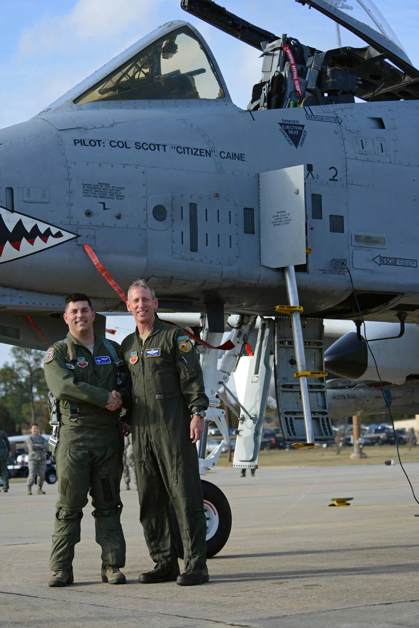 U.S. Air Force Capt. Eric Calvey (left), 74th Fighter Squadron A-10 instructor and chief of weapons, and Col. Scott Caine (right), 9th Air Force vice commander, stand in front of an A-10C Thunderbolt II following Caine’s final flight in the Air Force, Shaw Air Force Base, S.C., Feb. 8, 2017. Calvey acted as a wingman during Caine’s final flight that marked the end of the vice commander’s 30 years of service. (U.S. Air Force photo by Airman 1st Class Kathryn R.C. Reaves)