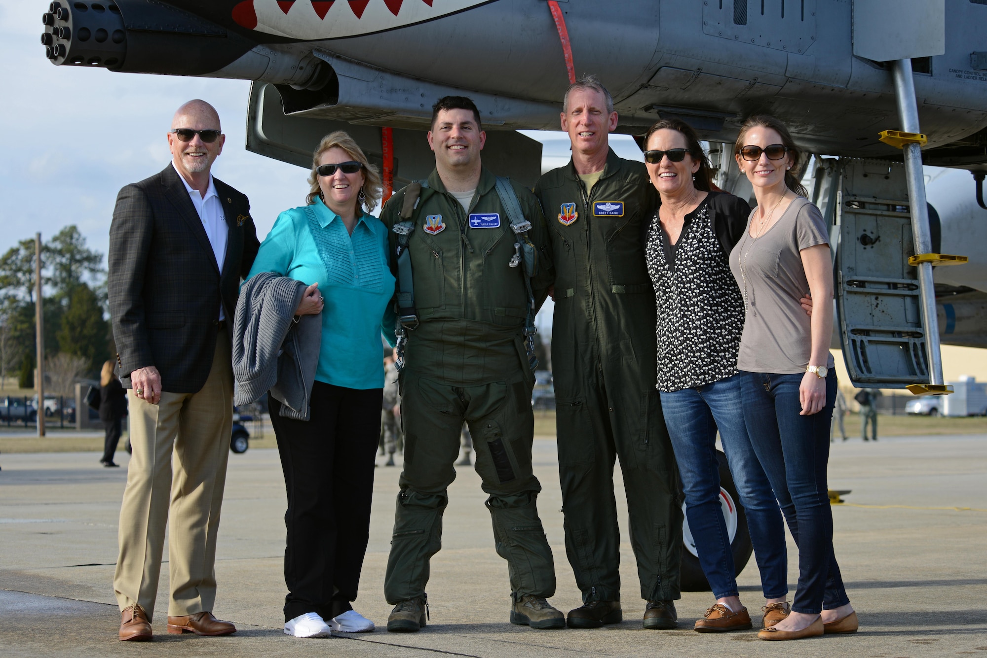 U.S. Air Force Col. Scott Caine, 9th Air Force vice commander, stands with family and friends following the final flight of his Air Force career, Shaw Air Force Base, S.C., Feb. 8, 2017. Family, friends and coworkers greeted Caine after he landed and participated in final flight traditions, such as hosing Caine with water. (U.S. Air Force photo by Airman 1st Class Kathryn R.C. Reaves)