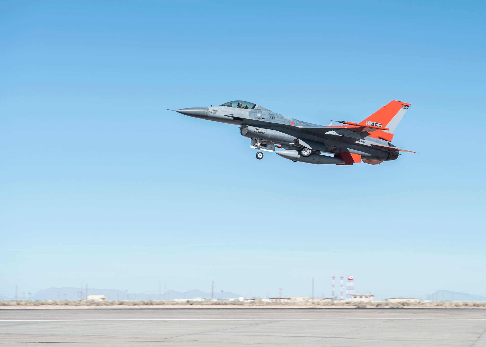 A QF-16 drone flies over Holloman Air Force Base, N.M., on Feb. 10, 2017. Lt. Col. Ronald King, the 82nd Aerial Targets Squadron, Det. 1 commander, piloted the drone during the first flight at Holloman since the transition from QF-4 Phantoms to QF-16s. The QF-16 serves as a full-scale aerial target to test next-generation weapons systems. (U.S. Air Force photo by Senior Airman Emily Kenney)
