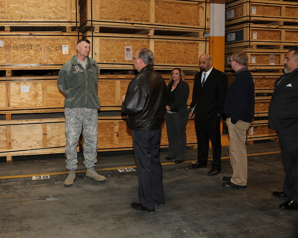 Lieutenant General Andrew E. Busch, U.S. Air Force, director, Defense Logistics Agency (Left); talks with Brent Cox, Director, DLA Distribution, MCLBB; as Elizabeth Carroll, Environmental Protection Specialist Supervisor, DLA Disposition Services, MCLBB; Christopher Camacho, Area Manager, DLA Disposition Services, MCLBB and Kevin Lindsey, Operations Manager, DLA Distribution, MCLBB tour Warehouse 11 with Busch, Jan. 26.
