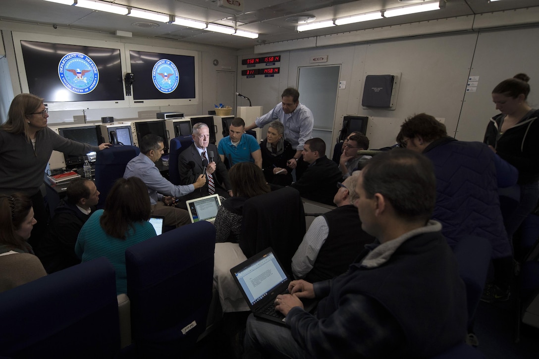 Defense Secretary Jim Mattis, center, briefs reporters while flying over the Atlantic Ocean en route to Brussels for a NATO Defense Ministerial, Feb. 14, 2017. DoD photo by Air Force Tech. Sgt. Brigitte N. Brantley