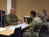 Staff Sgt. Timothy S. Coffey, 338th U.S. Army Reserve Command Band, (left) and 1st Lt. Jose Melendez, 1st Mission Support Command, rehearse how to properly inform a victim of the formal complaint process during a Capstone session in the 80-hour SHARP Foundations course hosted on Fort Buchanan, Puerto Rico.