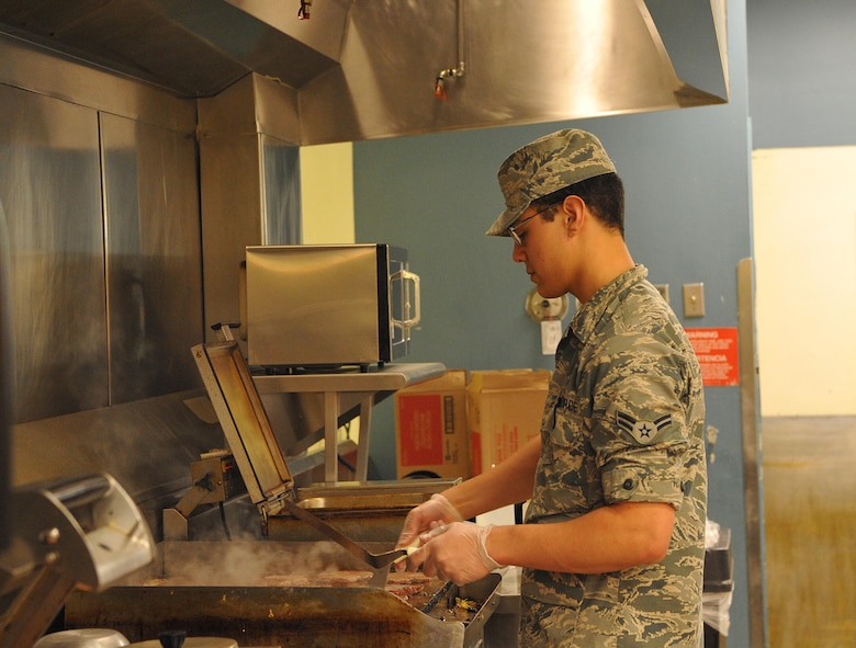 Airman 1st Class Ehiku Nunes-Lopez, 9th Force Support Squadron food service apprentice, makes food for evacuees in response to the Oroville spillway evacuation notice at Beale Air Force Base, California, Feb. 13, 2017. Beale provided evacuees with shelter, food, and water. (U.S. Air Force photo/Airman Tristan D. Viglianco)