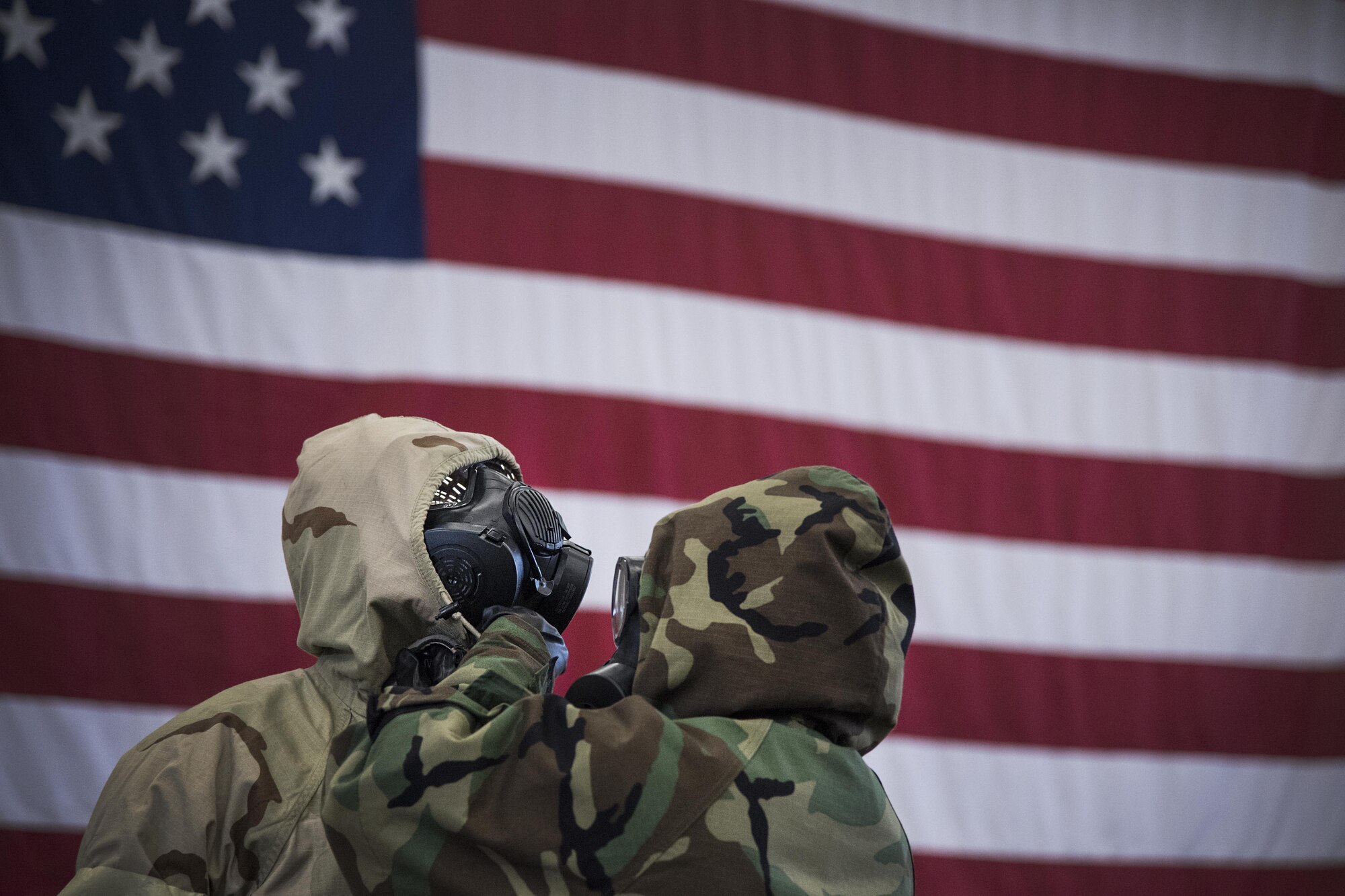 An Airman checks the lining of his wingman's Mission Oriented Protective Posture gear during ability to survive and operate training on Joint Base McGuire-Dix-Lakehurst, N.J., Feb. 8, 2016. The ATSO rodeo was hosted by the installation Emergency Management team, and was meant to prepare Airmen for an upcoming mobility exercise slated for later in the Spring. (U.S. Air Force photo/Senior Airman Lauren Russell) 