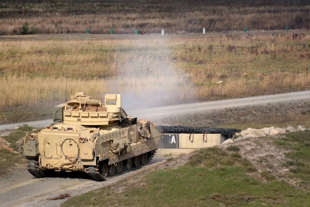 An M2A2 Bradley fighting vehicle engages a target during an exercise at Fort Stewart, Ga., Feb. 4, 2017. The Bradley crew is assigned to 1st Battalion, 64th Armor Regiment. Army photo by Maj. Randy Ready 