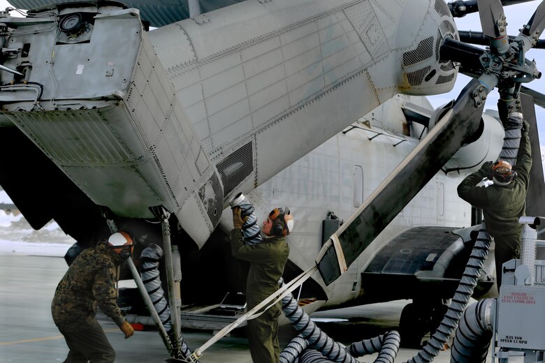 Marines with Marine Heavy Helicopter Squadron (HMH) 462 “Heavy Haulers” prepare a CH-53E Super Stallion for flight at Marine Corps Mountain Warfare Training Center, Bridgeport, Calif., Feb. 1. Marines use a heater to warm the main systems on CH-53Es and ensure the aircraft is ready before starting the engines. (U.S. Marine Corps photo by Lance Cpl. Dylan Overbay/Released)