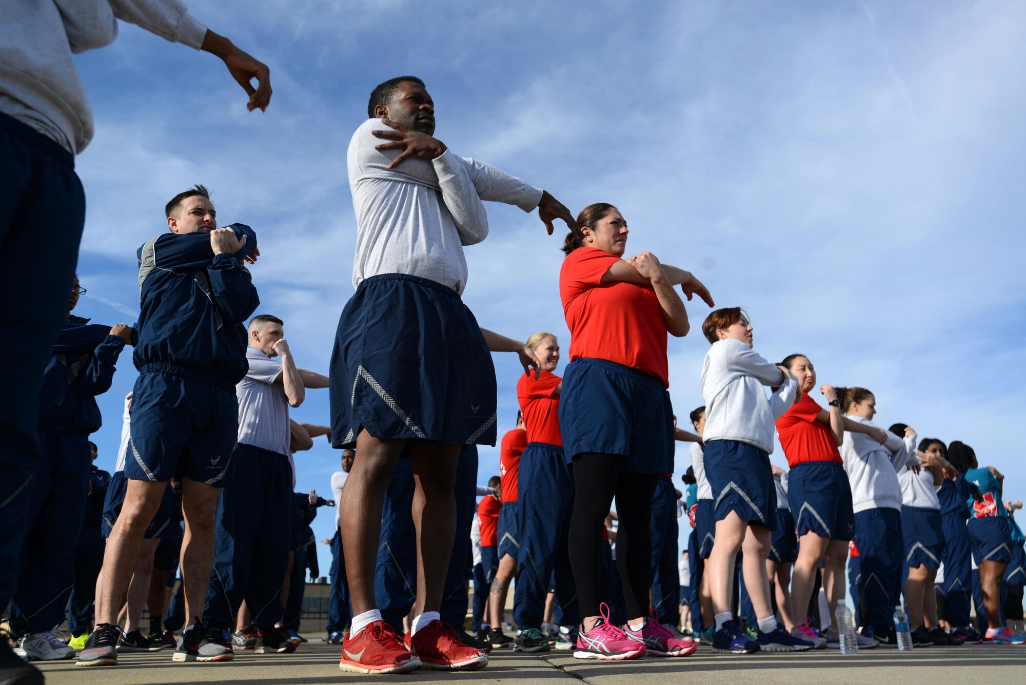 U.S. Airmen assigned to the 20th Medical Group stretch before a wing run at Shaw Air Force Base, S.C., Feb. 10, 2017. Wing runs tie into the physical aspect of the Air Force’s four domains of Comprehensive Airman Fitness, alongside the spiritual, mental and social domains. (U.S. Air Force photo by Airman 1st Class Kelsey Tucker) 