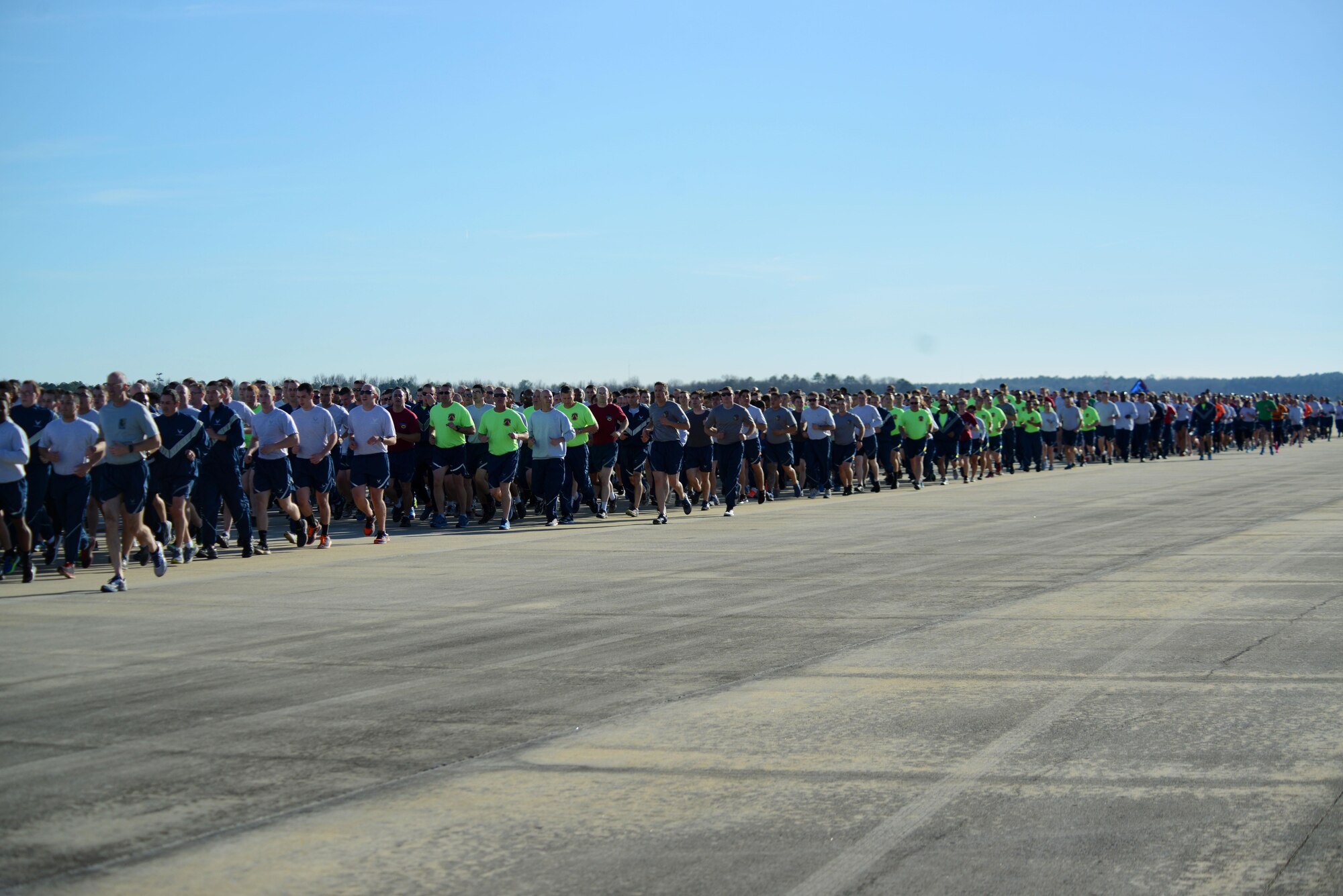U.S. Airmen assigned to the 20th Fighter Wing participate in a wing run at Shaw Air Force Base, S.C., Feb. 10, 2017. The formation ran two miles along the taxiway and runway, returning to the front of Hangar 1200 for a speech from Col. Daniel Lasica, 20th FW commander, before being dismissed for the weekend. (U.S. Air Force photo by Airman 1st Class Kelsey Tucker)