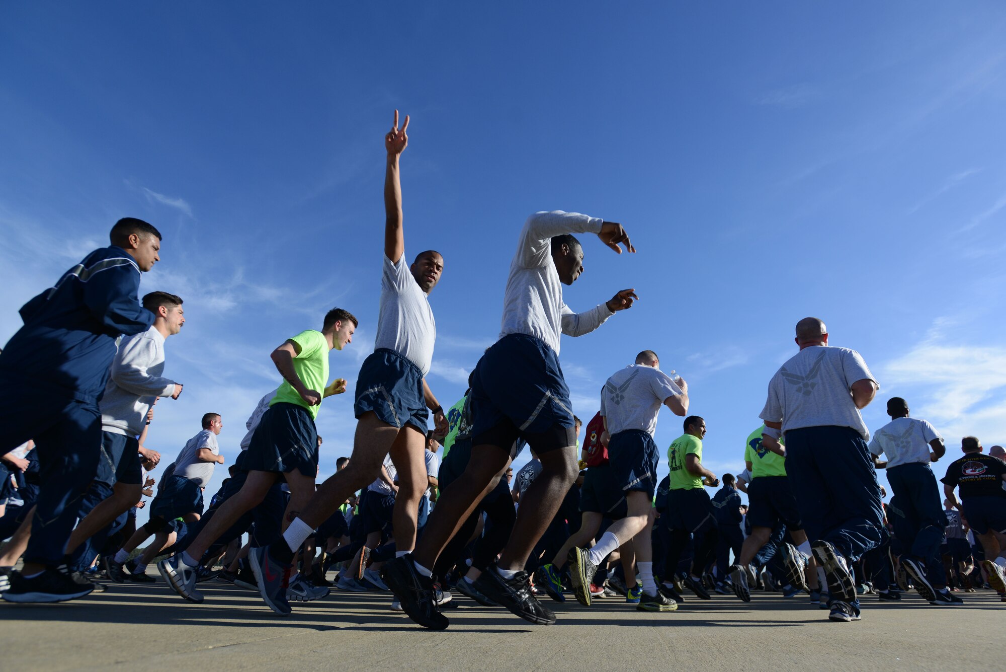 U.S. Airmen assigned to the 20th Fighter Wing run along the flightline during a wing run at Shaw Air Force Base, S.C., Feb. 10, 2017. The run was held to boost morale and increase team readiness and cohesion throughout the wing. (U.S. Air Force photo by Airman 1st Class Kelsey Tucker)