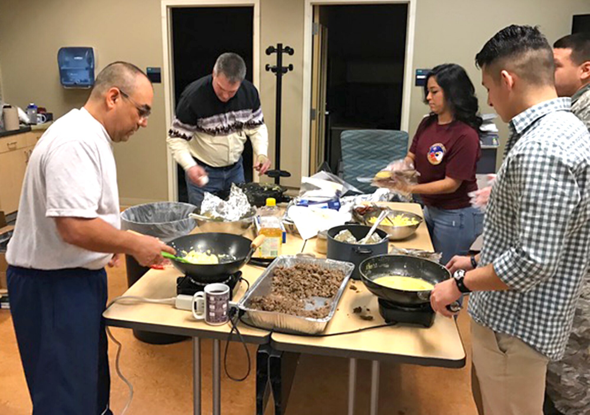 Members of the 433rd Airlift Wing Top 3 association prepare tacos for the C-5 Rodeo Breakfast Feb. 9, 2017 at Joint Base San Antonio-Lackland, Texas. (U.S. Air Force photo by Senior Master Sgt. Jorge DeJesus)