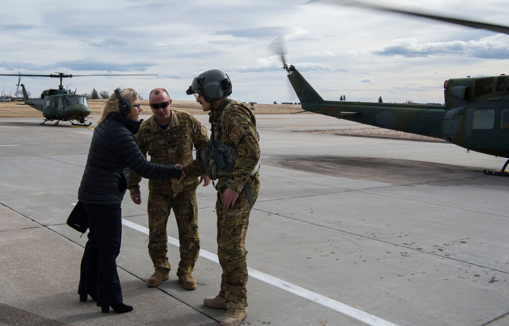 U.S. Rep. Liz Cheney shakes hands with Capt. Josiah Hart, 37th Helicopter Squadron pilot, before boarding a 37th HS UH-1N Huey at F.E. Warren Air Force Base, Wyo., Feb. 10, 2017. Cheney was educated on the capabilities of the helicopter squadron which supports the 90th Missile Wing with convoy defense and the local area with search and rescue efforts. (U.S. Air Force photo by Staff Sgt. Christopher Ruano)
