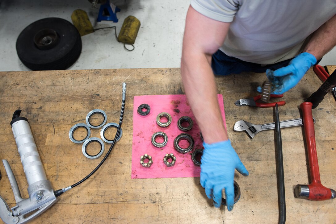 Senior Airman Joe Hanchey, 349th Aerospace Generation Equipment Flight mechanic, cleans and renews grease on wheel bearings from a self-generating nitrogen cart Feb. 6, 2017, at Travis Air Force Base, Calif.
Hanchey is one of hundreds of Citizen Airmen from the 349th Maintenance Group who are participating in Wrench Week 2017. The weeklong event not only provides opportunities to accomplish ancillary training, and upgrade training, but also practical experience necessary to sharpen their primary job skills.
Additionally, the work accomplished by the reservists also helps active duty Airmen assigned to Travis keep up with the high demands of the Air Mobility Command mission. (U.S. Air Force photo by Ken Wright)