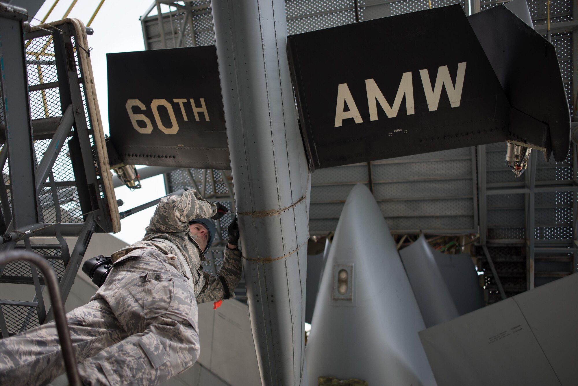 Air Force Staff Sgt. Charles Womack, 349th Maintenance Squadron crew chief, replaces a panel on the boom of a KC-10 Extender at Travis Air Force Base, Calif., Feb. 7, 2016. This week, Womack is working alongside hundreds of fellow Citizen Airmen from the 349th Maintenance Group to support Wrench Week 2017. The event offers opportunities for reservists to accomplish ancillary training, upgrade training, and gain practical experience necessary to sharpen their primary job skills. (U.S. Air Force photo by Ken Wright)