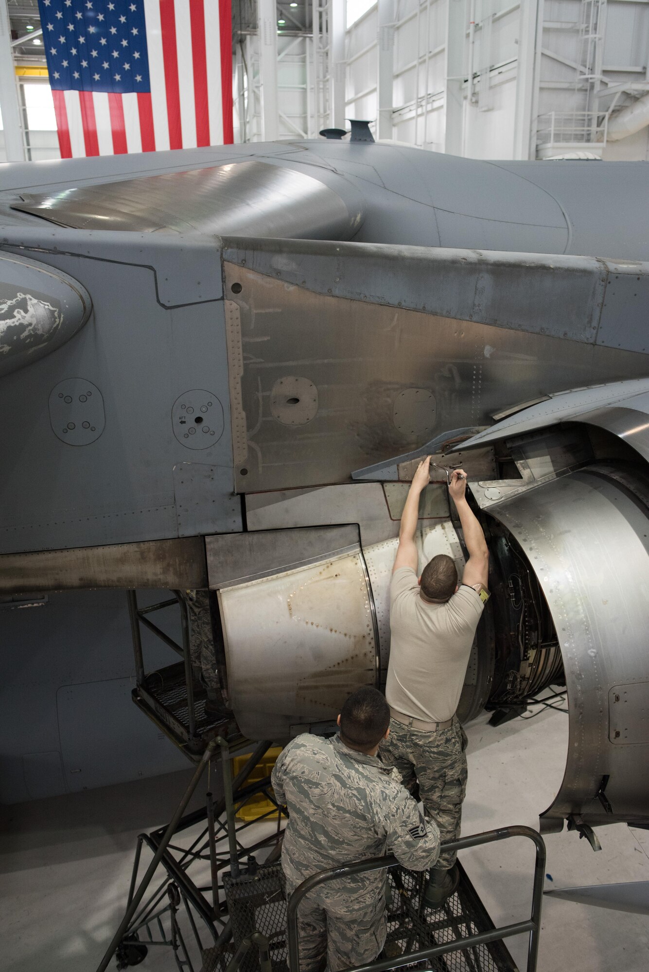 Citizen Airmen from the 945th Aircraft Maintenance Squadron at Travis Air Force Base, Calif., work together to replace C-17 Globemaster III engine panels, Feb. 10, 2017. The reservists were on duty to participate in Wrench Week 2017, which offers Citizen Airmen opportunities to reinforce and build their primary job skills. (U.S. Air Force photo by Ken Wright)
