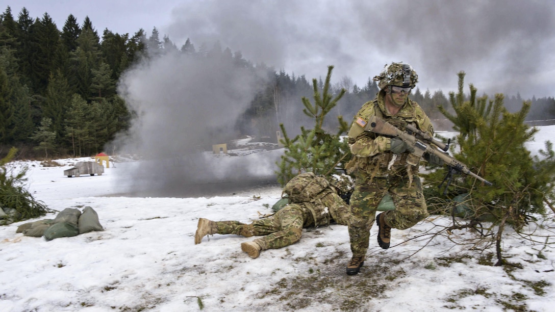 Soldiers operating as snipers maneuver during a combined arms live-fire exercise at the 7th Army Training Command's Grafenwoehr Training Area, Germany, Feb. 6, 2017. Army photo by Gerhard Seuffert