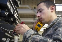 Airman 1st Class Kevin Kieser, 88th Communications Squadron Telephone Repair Shop voice network system technician, listens for a dial tone, Jan. 27, 2017, as he troubleshoots a problem with a phone line at Wright-Patterson Air Force Base, Ohio.  Tens of thousands of individual phone lines are routed through the phone shop and technicians need to find the correct needle in the haystack to fix any issue a particular line may have. (U.S. Air Force photo by R.J. Oriez/Released)