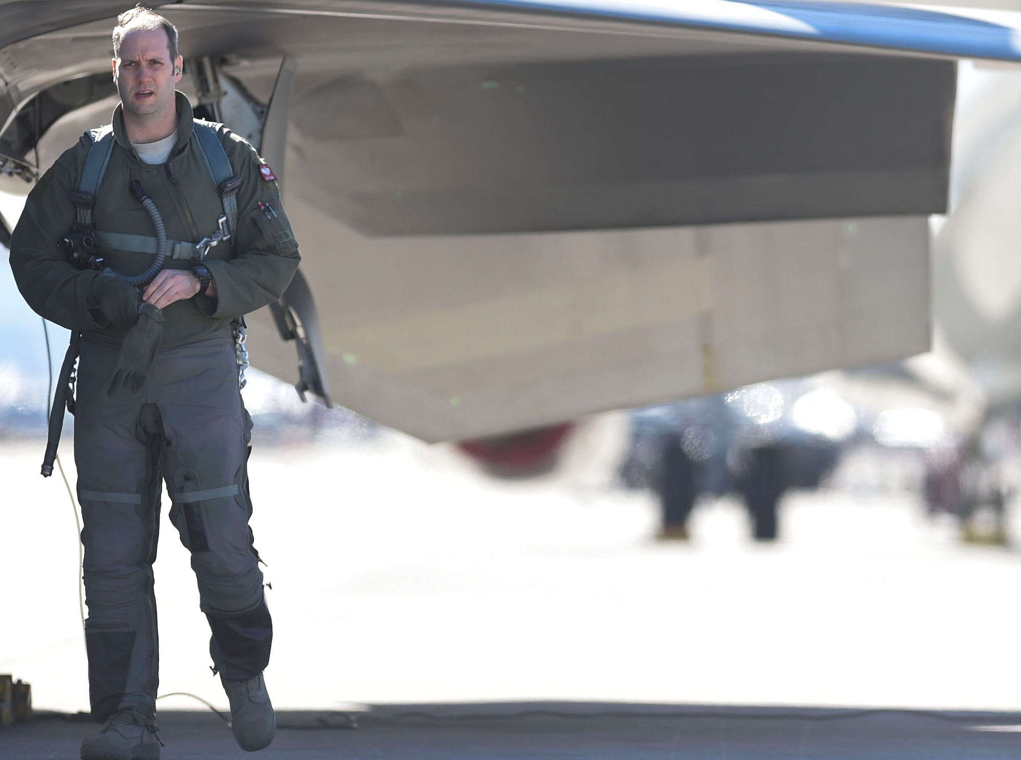 A 1st Fighter Wing F-22 Raptor pilot conducts a walk-around his aircraft before boarding during Red Flag 17-1 at Nellis Air Force Base, Nev., Jan 26, 2017. The Raptors out of Joint Base Langley-Eustis, Va., are working alongside the F-35A Lightning II to suppress enemy targets and provide targeting and cover for fourth-generation aircraft. (U.S Air Force photo by Staff Sgt. Natasha Stannard)
