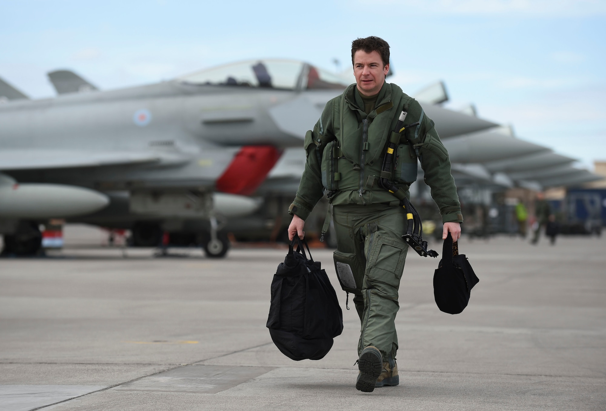 Royal Air Force Flight Lt. Jonny Mulhall, 6th Squadron Eurofighter Typhoon pilot, walks to his aircraft during Red Flag 17-1 at Nellis Air Force Base, Nev., Feb. 7, 2017. The Royal Air Force and Australian Air Force participated in 17-1 alongside their U.S. partners to enhance tactics, techniques and procedures in air, space and cyber domains. (U.S Air Force photo by Staff Sgt. Natasha Stannard)