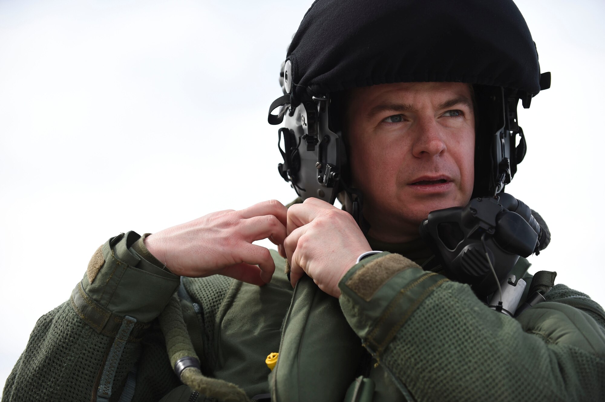 Royal Air Force Flight Lt. Jonny Mulhall, 6th Squadron Eurofighter Typhoon pilot, secures his helmet during Red Flag 17-1 at Nellis Air Force Base, Nev., Feb. 7, 2017. With the integration of cyber and space in battlefield domains, fifth generation fighter aircraft are better able to support fourth-generations like the Typhoon in suppressing enemy targets. (U.S Air Force photo by Staff Sgt. Natasha Stannard)