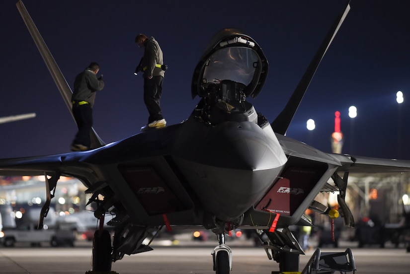 Maintainers with the 27th Aircraft Maintenance Unit out of Joint Base Langley-Eustis, Va., check for structural damages on an F-22 Raptor during Red Flag 17-1 at Nellis Air Force Base, Nev., Jan. 27, 2017. If damages are found, low observable aircraft structure technicians must repair them to ensure the aircraft maintains its stealth capability. (U.S. Air Force photo by Staff Sgt. Natasha Stannard)