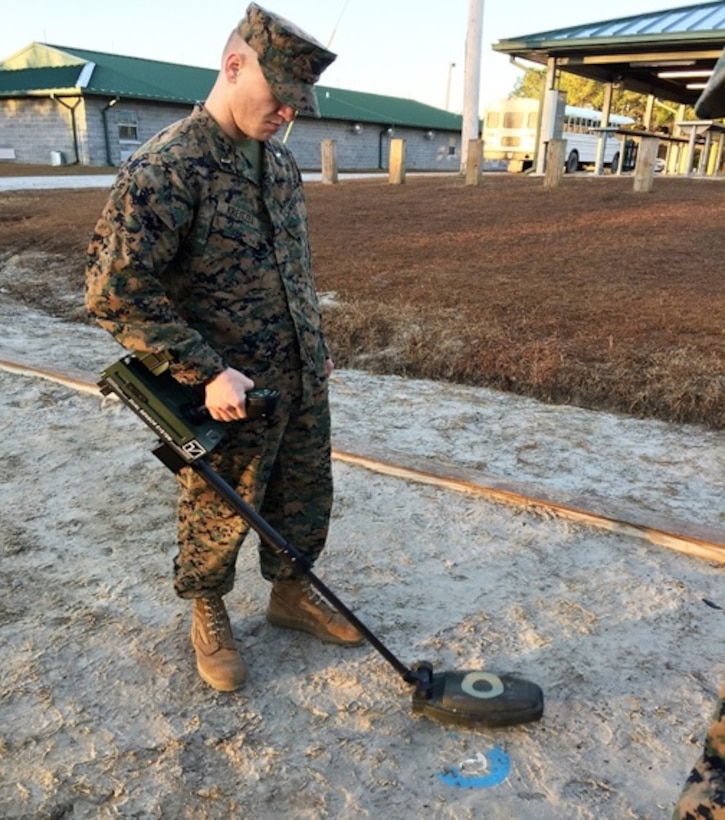 On January 13, 2017  Second Lieutenant Clark Kreitzer, a Marine attached to Combat Engineer Officer course 1-17 (CEO 1-17); practices using a  VMR-2 Minehound. The VMR-2 is a compact , dual sensor explosive hazard detector. This device is designed for the detection of buried or submerged high metallic, low metallic, and non-metallic explosive hazards. This piece of equipment is particularly important because of its ability to detect enemy IED’s, which have become the largest threat to our military forces. 
