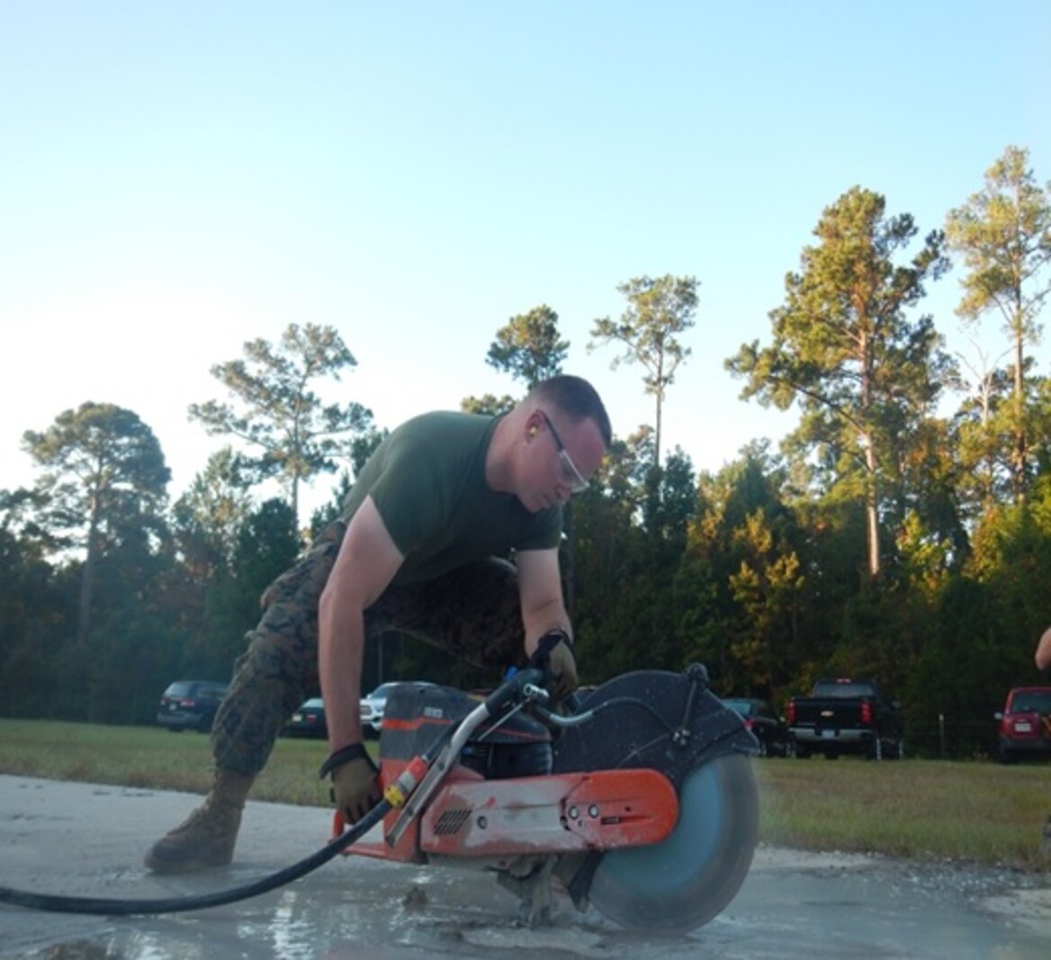 On October 18, 2016 Second Lieutenant Taylor Hershberger, a Marine attached to Combat Engineer Officer course 1-17 (CEO 1-17); uses a cut-off saw to cut out a spall on a damaged airfield. This is an important process that allows the damaged area to be resurfaced and allows the continuation of airfield operations.
