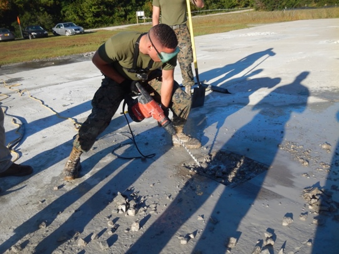 On October 18, 2016 Second Lieutenant Kristopher Satterwhite, a Marine attached to Combat Engineer Officer course 1-17 (CEO 1-17); uses an electric hammer drill to clear out concrete from a spall that has been cut out. This must be done before the damaged area can be resurfaced. Engineers need to be proficient in airfield damage repair so that airfield operations can are uninterrupted.
