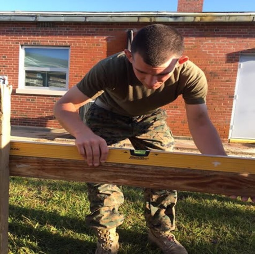 On October 20, 2016 Second Lieutenant Jonathan Neltner, a Marine attached to Combat Engineer Officer course 1-17 (CEO 1-17); levels the batter boards of a building layout. Batter boards are a temporary framework used to assist in locating corners when laying out a foundation. They support the building lines during the early stages of construction and are used as reference points.
